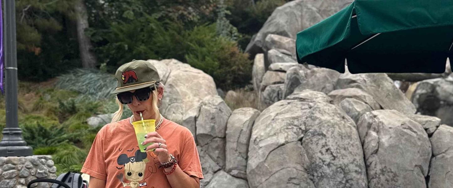 Person in a themed outfit with a backpack in front of rocky landscape